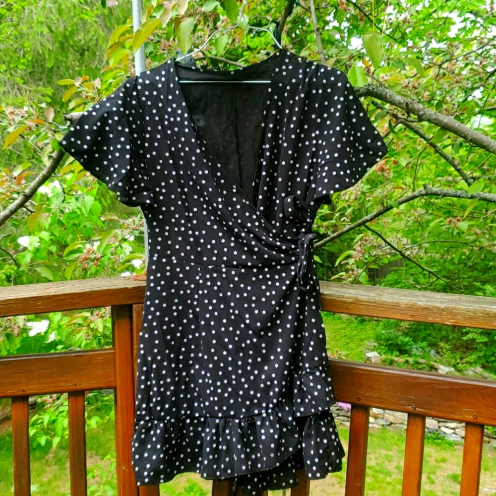 Black and white polka-dot wrap dress.